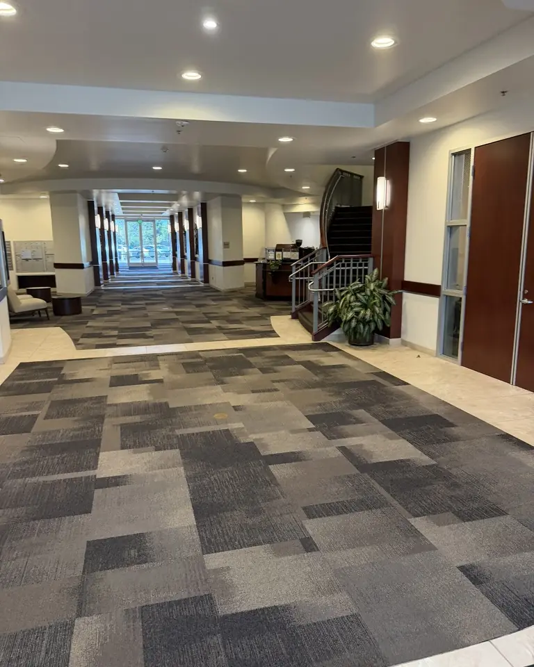 The lobby of the Blue Oaks office building with a staircase and tall windows